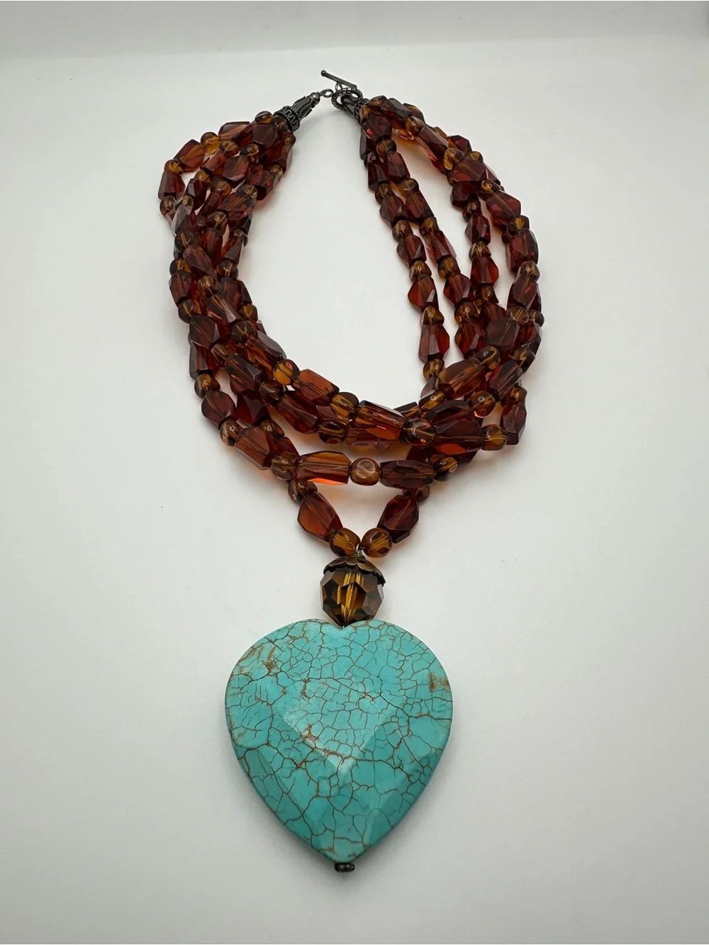 Multi-Strand Amber Glass Necklace with Turquoise Heart Pendant